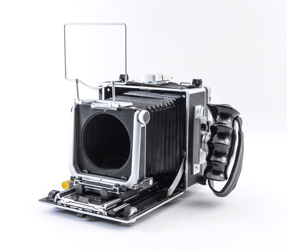 LINHOF MASTER TECHNIKA 4X5 CAMERA: LINHOF MASTER TECHNIKA 4X5 CAMERA: Linhof Master Technika large format camera manufactured in the mid-1980s. Serial #6421568. Comes with left hand grip, rangefinder, a Linhof duplex 4x5 film holder, a