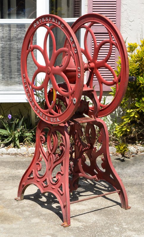 ENTERPRISE FLOOR MODEL COFFEE MILL GRINDER: ENTERPRISE FLOOR MODEL COFFEE MILL GRINDER: Model No. 18, heavy cast iron body and top, double wheel, repainted, missing hopper. Overall measures 56'' h. x 30 1/2'' x 23''.