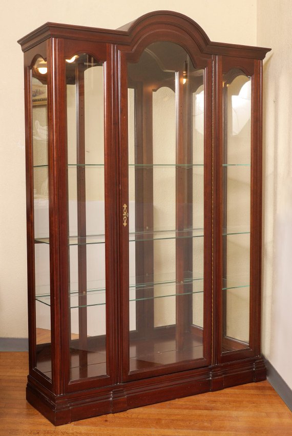 JASPER LIGHTED DISPLAY CABINET: JASPER LIGHTED DISPLAY CABINET: Arched center door, glass panels either side and side windows. Mirrored back illuminated interior with shelves. Overall measures 78 3/4'' h. x 52'' x 13 3/4''.