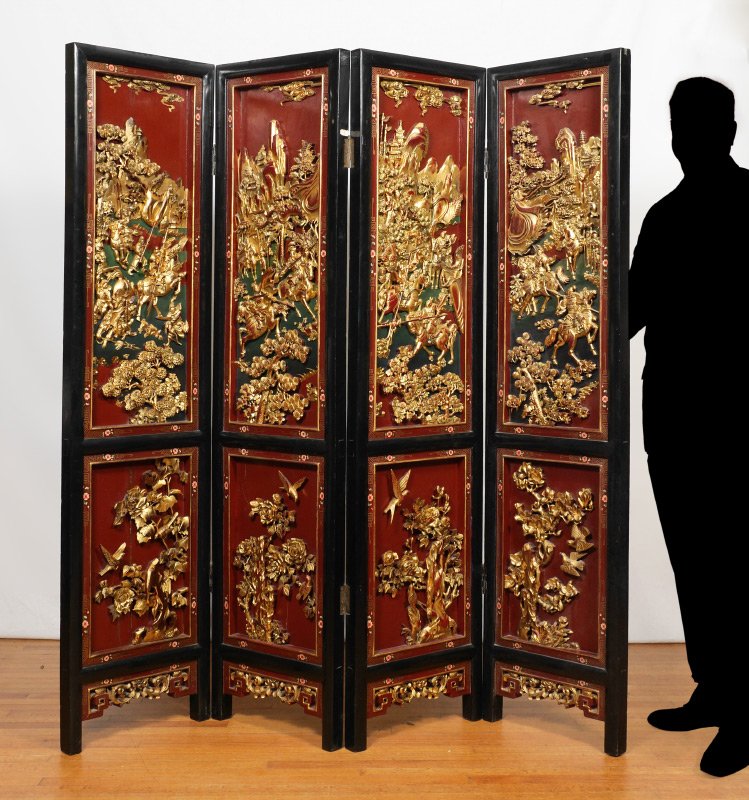 CHINESE CARVED 4 PANEL FLOOR SCREEN: CHINESE CARVED 4 PANEL FLOOR SCREEN: Each section red lacquer ground with gilt decorated carved relief panel of warriors over foliate panel, framed with painted floral decoration, black lacquer outer 