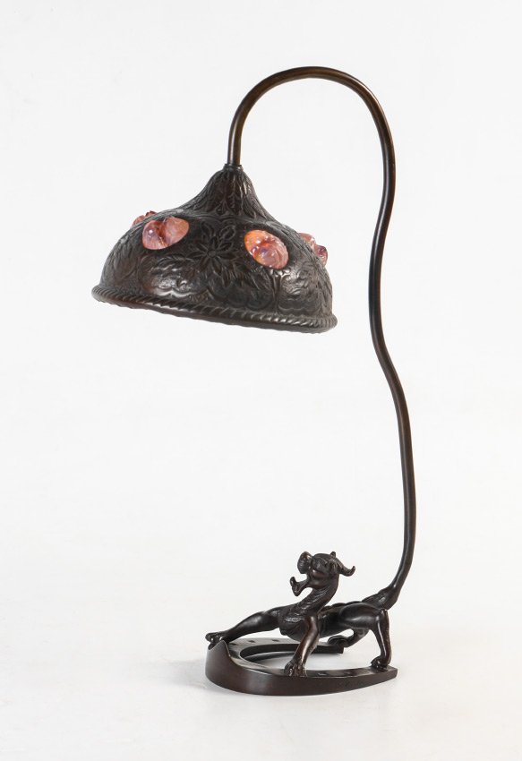 AFTER CARL KAUBA AUSTRIAN BRONZE LAMP: AFTER CARL KAUBA AUSTRIAN BRONZE LAMP: Lamp base with figural mythological dragon creature on horseshoe shape base, the creatures tail extending upward as support for embossed metal shade with jeweled