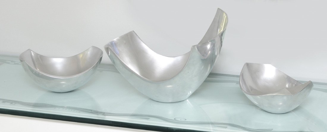 SET OF MICHAEL LAX "METAAL" ALUMINUM MODERNE BOWLS: SET OF MICHAEL LAX ALUMINUM "METAAL" BOWLS: Set of 3 moderne design display or center bowls, all marked to bottom with model #'s - 6013, 6210 and the largest #6115 which measures 10 1/4" x 13 1/2" x 1
