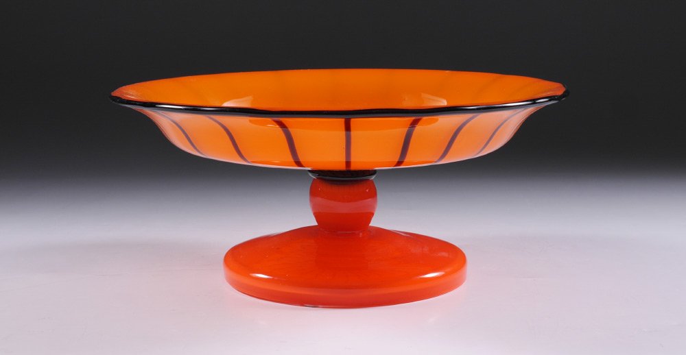 LOETZ ORANGE TANGO ART GLASS COMPOTE: LOETZ ORANGE TANGO ART GLASS COMPOTE: Orange with black stripe decoration, slightly ribbed rim, unmarked, 4 1/2" h. x 10".