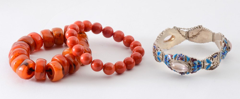 3 BRACELETS CORAL QUARTZ CLOISONNE ENAMELING: 3 BRACELETS: 1) 19 Orangish-Brown stone rondelle disks ranging from 16mm to 20mm. 2) 13 Round Oxblood Coral Beads, 11 MM each in diameter. 3) Oriental Silver paneled bracelet alternating with cabochon