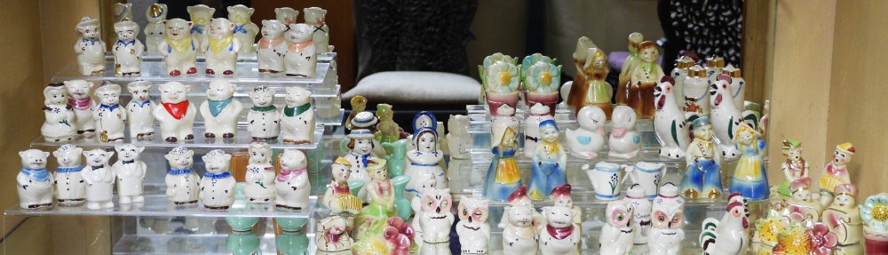 ESTATE SHAWNEE POTTERY COLLECTION: SHAWNEE POTTERY COLLECTION: 72 Salt & Pepper shakers total count, assorted animal, flower, figural motifs. Tallest are the Dutch Boy and Girl & the Charlicleers, 5"h. each. Several true pairs. Sold as