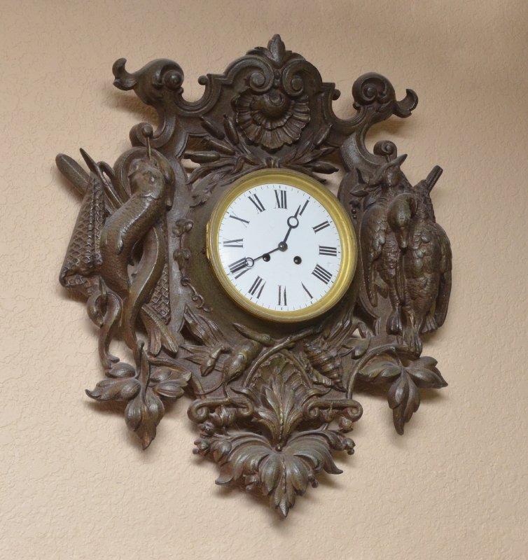 JAPY FRERES FIGURAL CAST IRON WALL CLOCK: JAPY FRERES FIGURAL CAST IRON WALL CLOCK: Rococo style cast iron framed clock with figural fish, crawfish, shells and game birds. Porcelain dial with Arabic numerals, key wind and pendulum Japy Freres