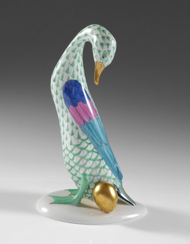 HEREND FISHNET GOOSE WITH GOLDEN EGG: HEREND FISHNET GOOSE WITH GOLDEN EGG: Green with blue, pink and teal wings, gold accents, approx. 7 5/8''h.