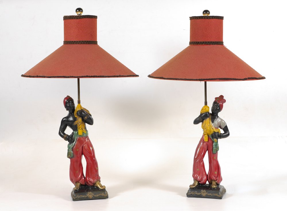 PAIR VINTAGE BLACKAMOOR TABLE LAMPS: PAIR VINTAGE BLACKAMOOR TABLE LAMPS: Mid 20th century polychrome decorated pottery blackamoor figures, no visible markings or label, single socket fixture, overall 33" h. x 8 1/2" h. x 5". Sold with s