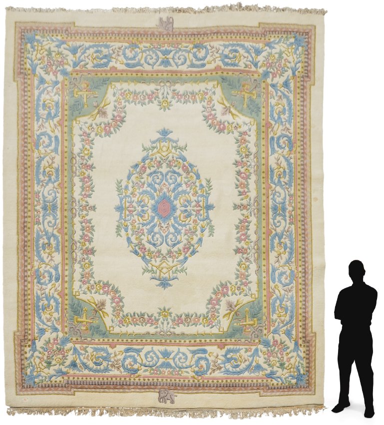 INDO-AUBUSSON HAND KNOTTED WOOL RUG 12'1" x 15'3": APPROX. 50-65 YR OLD INDO-AUBUSSON HAND KNOTTED WOOL RUG, 12'1" x 15'3": This large room size rug has a traditional French Aubusson design with a pale blue, pink, and yellow oval central medallion on 