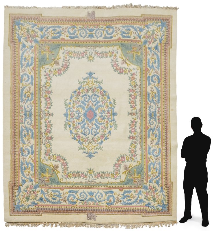 INDO-AUBUSSON HAND KNOTTED WOOL RUG 9'1" x 12'3": APPROX. 50-65 YR OLD INDO-AUBUSSON HAND KNOTTED WOOL RUG, 9'1" x 12'3": This rug is a mate to another larger rug in this auction, lot 1089. It's traditional French Aubusson design includes a pale blue