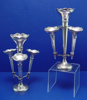 PAIR OF ENGLISH SILVER EPERGNES: PAIR OF ENGLISH SILVER EPERGNES: Trumpet vase plus three arms with removable vases. Hallmarks indicat 1926 London, makers Charles & Richard Comyns. 7 1/8". Monogram R., weighted. Please note slight de