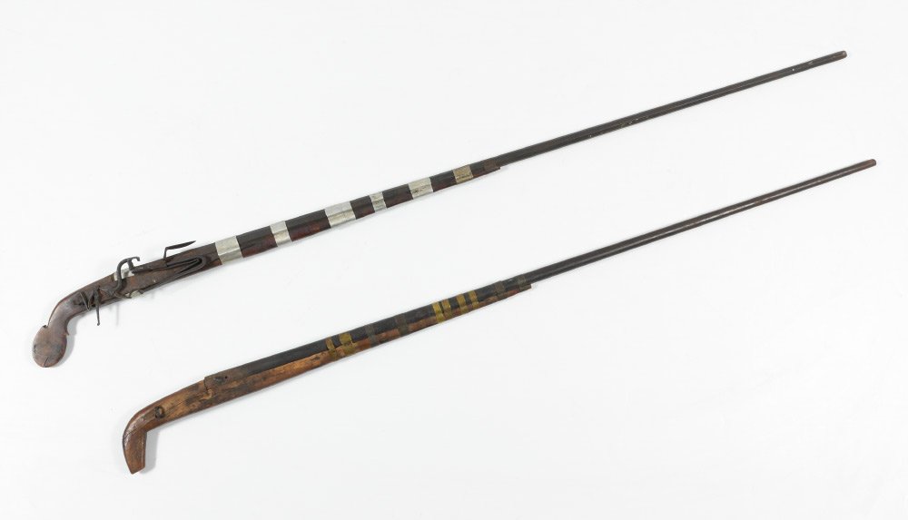 2 NORTH AFRICAN ANTIQUE RELIC RIFLES: 2 NORTH AFRICAN ANTIQUE RELIC RIFLES: 2 pieces total in as found condition to include 1) 49'' octagonal barrel, .40 caliber smooth bore, matchlock, carved stock, metal connecting bands, overall 54 1/2