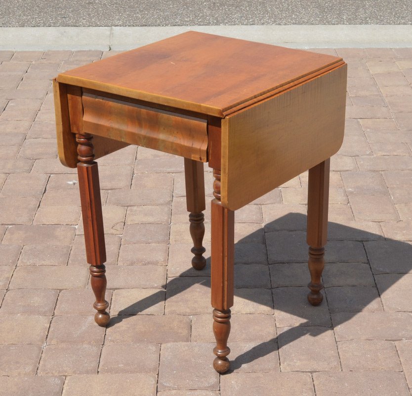 TIGER MAPLE TOP DROP LEAF WORK TABLE: TIGER MAPLE TOP DROP LEAF WORK TABLE: Mixed wood construction with tiger maple top, 2 drop leaves over single drawer, carved and turned legs. Overall measures 29'' h. x 21 3/4'' x 21 3/4'', 10'' drop 