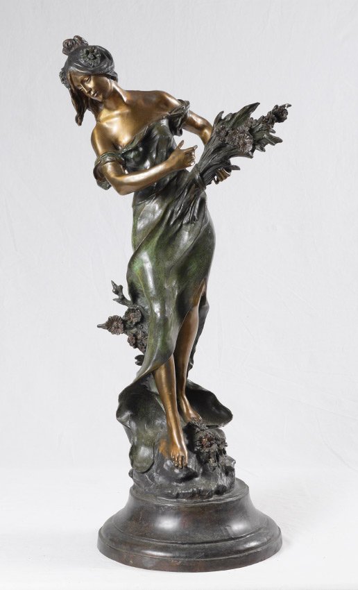 AFTER AUGUSTE MOREAU BRONZE MAIDEN WITH FLOWERS: AFTER AUGUSTE MOREAU BRONZE MAIDEN WITH FLOWERS: Second half 20th century after Auguste Moreau, patinated bronze figure of a standing maiden holding a bouquet of flowers. Signed Aug. Moreau near base,