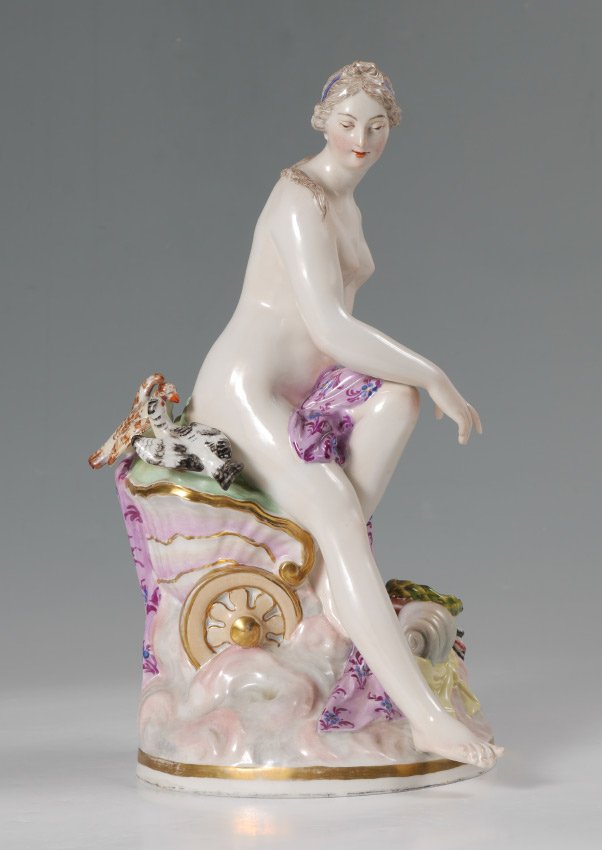 KPM PORCELAIN FIGURE OF A NUDE MAIDEN: KPM PORCELAIN FIGURE OF A NUDE MAIDEN: Figure of a seated nude maiden on carriage with birds, lower urn and quiver, marked on base with KPM blue underglaze scepter mark. 13'' h. x 7'' x 7 1/2''.