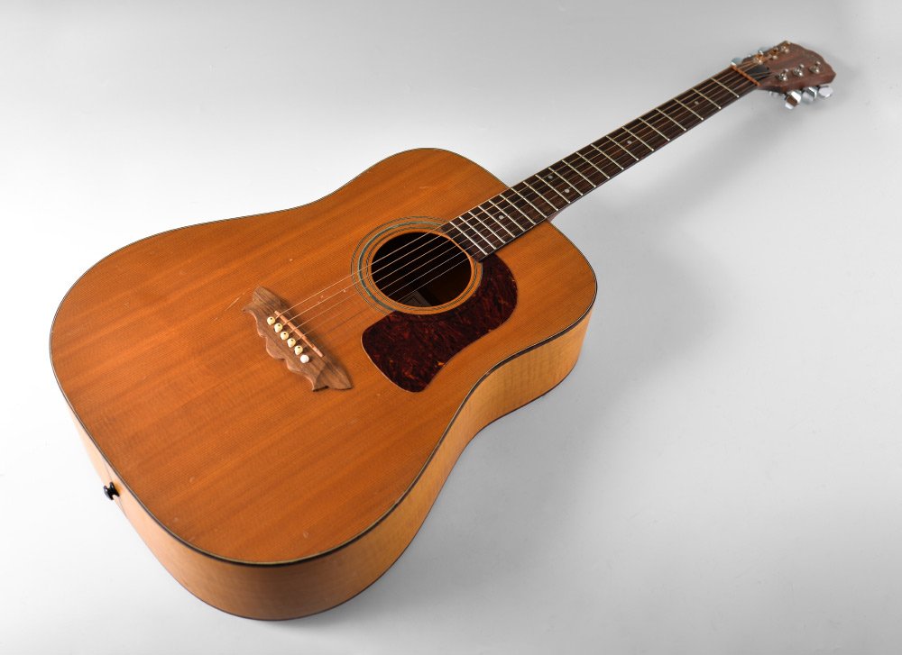 WASHBURN D47 NAVAJO ACOUSTIC GUITAR: WASHBURN D47 NAVAJO ACOUSTIC GUITAR: Part of the Native American series by Washburn, model D47, serial number 5739, inlaid trim on ribs and line down back. Back measures 19 3/4'', overall 40'' h. x 15