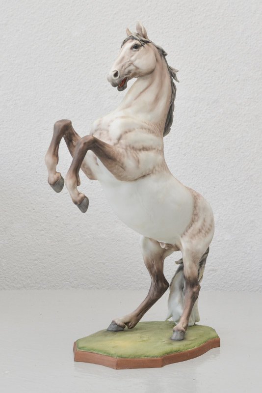 KAISER BISQUE CAPITANO HORSE FIGURE: KAISER BISQUE CAPITANO HORSE FIGURE: Figure of rearing horse, marked on base, limited edition of 1500 painted figures, incised artist signature on base. Measures 13 1/2'' h. x 10'' x 4 1/2''