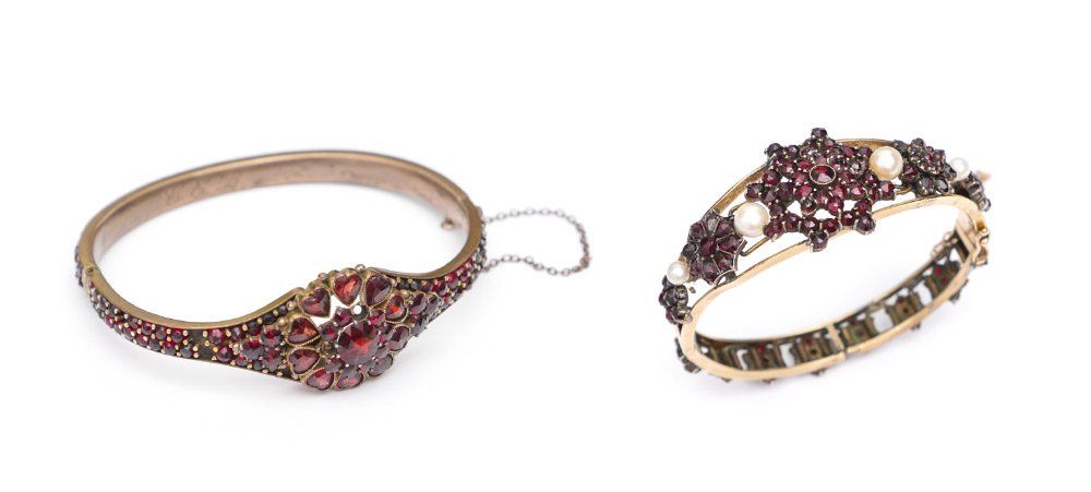 LOT OF 2 GARNET BANGLE BRACELETS: LOT OF 2 GARNET BANGLE BRACELETS: 1) 14K yellow gold garnet and culture pearl bangle. Length is 6 1/4" and weight is approx. 20 ctw. The garnets are prong set. 8 garnets are missing. Lead solder repai