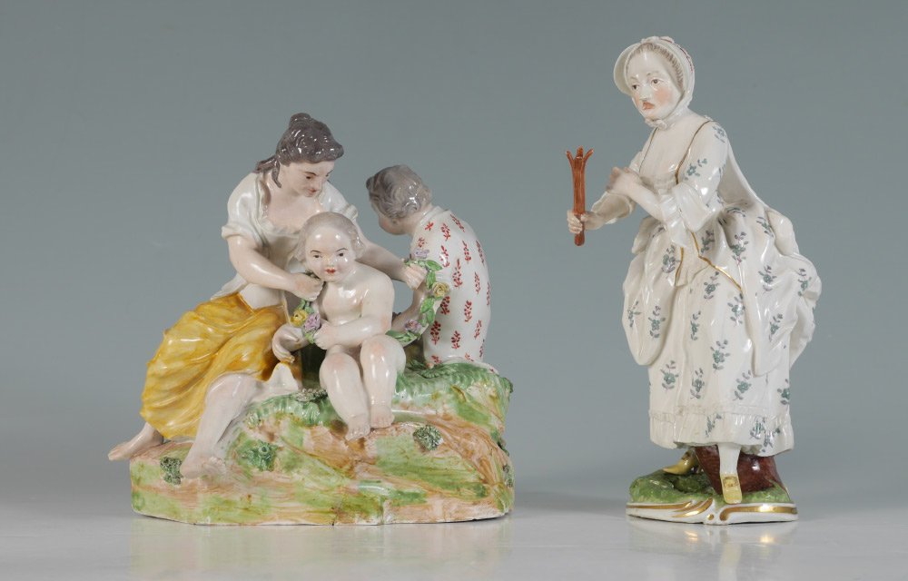2 FRANKENTHAL PORCELAIN FIGURES: 2 FRANKENTHAL PORCELAIN FIGURES: 2 pieces total to include 1) Figural group of woman, man and putti with floral garland and baskets, blue mark on base, measures 5 3/4" h. x 6 1/2" x 6 1/2". 2) Figure 