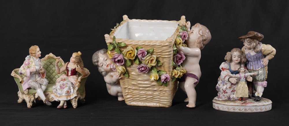 3 VOLKSTEDT GERMAN PORCELAIN FIGURAL GROUPS: 3 VOLKSTEDT GERMAN PORCELAIN FIGURAL GROUPS: 3 pieces total each with the blue ''fork'' mark to include 1) Boy and girl with a doll, 5 1/4'' h. x 4'' x 3 1/4''. 2) Pair of lovers on a couch, 4 1/4'' h