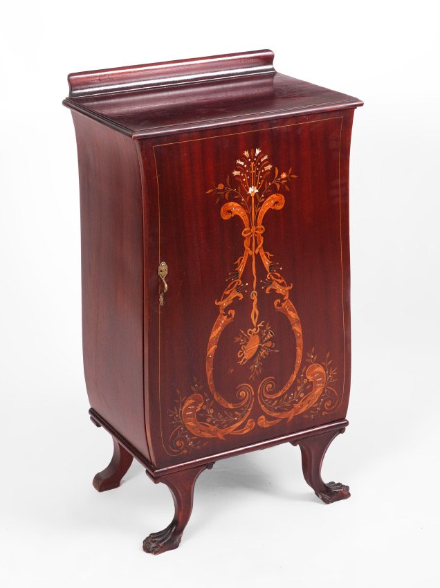 MARQUETRY INLAID MUSIC CABINET: MARQUETRY INLAID MUSIC CABINET: Shaped mahogany case, marquetry inlaid front door with foliate scroll, musical instruments and abalone shell accents, front carved paw feet, 5 internal shelves. Overall