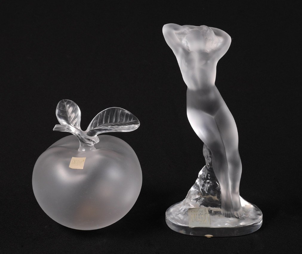 2 PIECE LALIQUE CRYSTAL APPLE AND NUDE MAIDEN: 2 PIECE LALIQUE CRYSTAL APPLE AND NUDE MAIDEN: 2 pieces total to include 1) Frosted nude figural maiden "Danseuse Bras Baisse", signed Lalique France, with original labels, 9 1/4" h. x 4 1/2" x 3". 2)