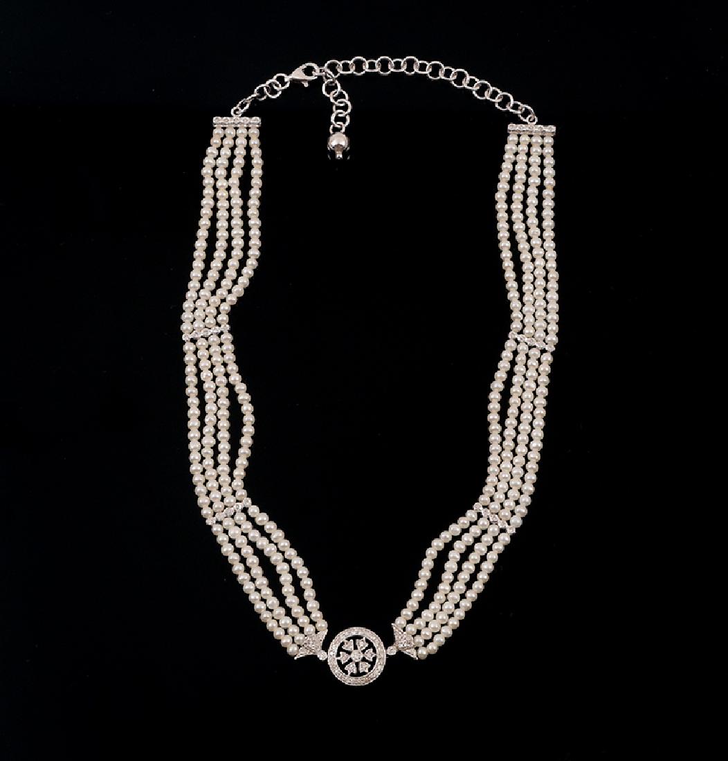 14K EDWARDIAN REVIVAL DIAMOND & CULTURED PEARL CHO: 14K EDWARDIAN REVIVAL DIAMOND & CULTURED PEARL CHOKER: 4 rows of cultured pearls accented with 75 round full cut diamonds form an adjustable 16'' choker. Settings and links are 14K white gold. Diamond
