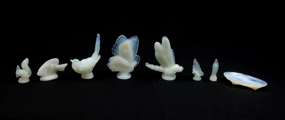 COLLECTION OF 8 SABINO OPALESCENT GLASS FIGURES: COLLECTION OF 8 SABINO OPALESCENT GLASS FIGURES: 8 pieces total to include 1) Large closed wing butterfly, 5 3/4'' h. 2) Small open wing butterfly, 2 1/2'' h. 3) Large dragonfly, 5 7/8'' h. x 5 1/4''.