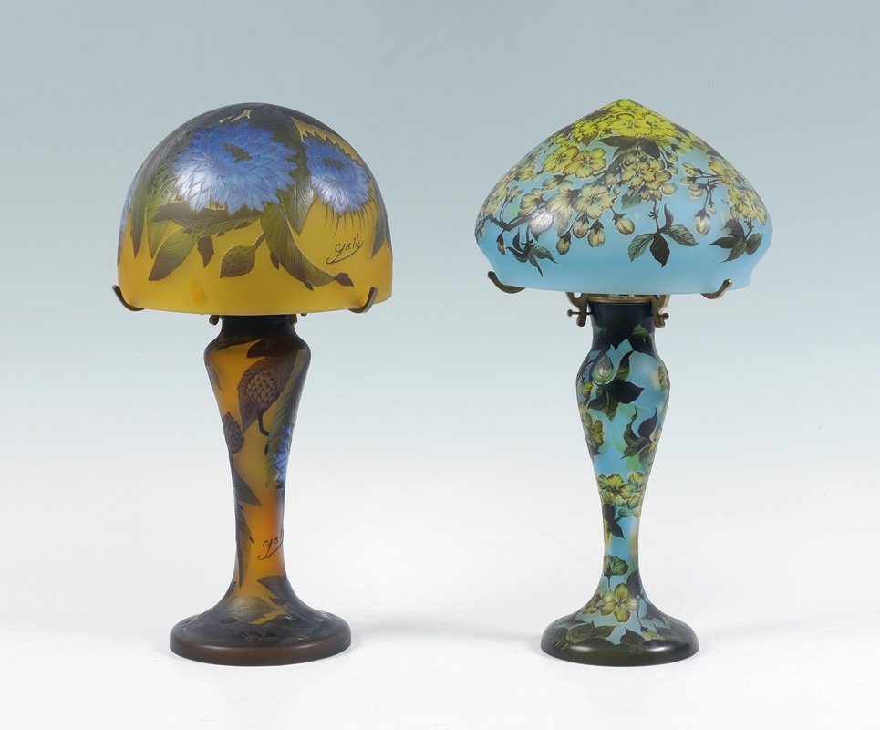 2 GALLE STYLE CAMEO CUT BOUDOIR LAMPS: 2 GALLE STYLE CAMEO CUT BOUDOIR LAMPS: 2 lamps each with spurious Galle signature to include 1) Blue ground with yellow flowers, base measures 13" h. x 7 1/2". Shade 6" h. x 9 1/2", fitter rim 8 1/2".