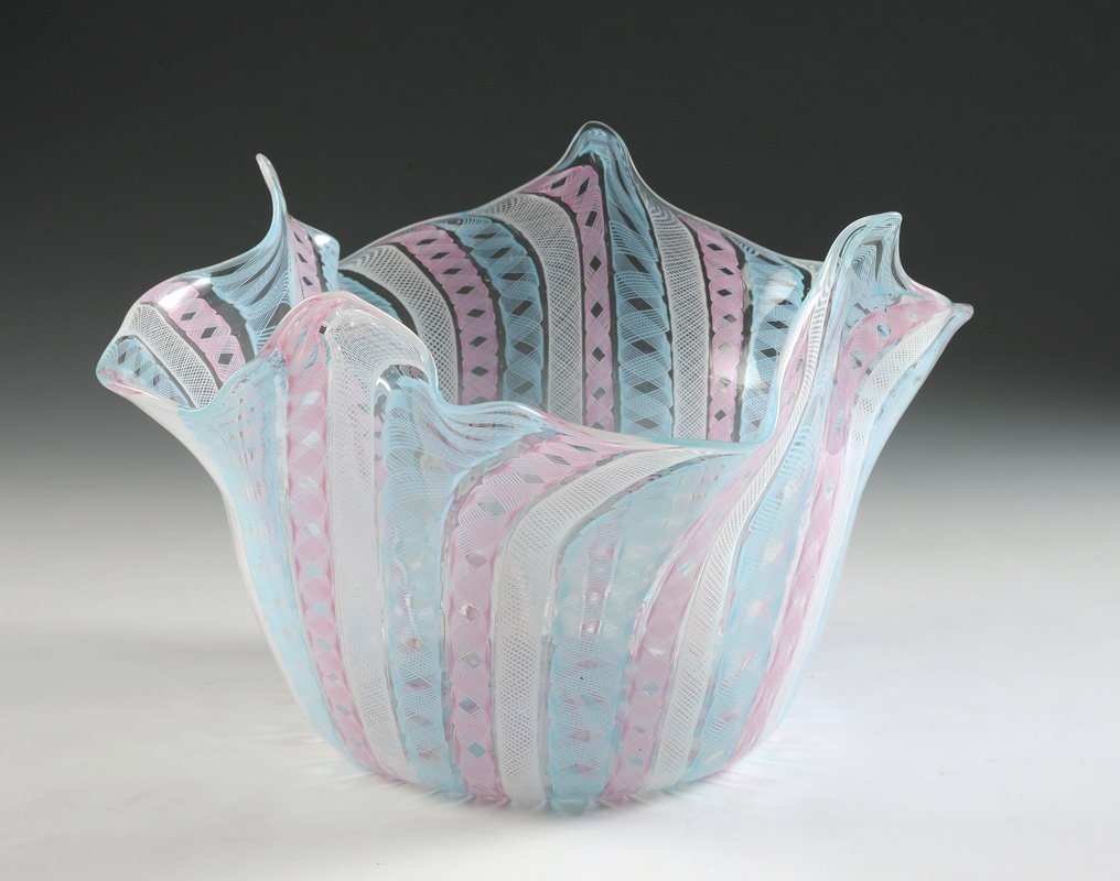 MURANO LATTICINO GLASS HANDKERCHIEF VASE: MURANO LATTICINO GLASS HANDKERCHIEF VASE: Free form rim, alternating blue, pink and white latticino bands, unmarked. 8 1/4" h. x 12 3/4" dia.