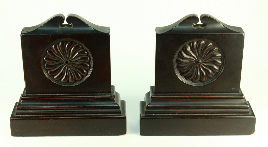 Georgian Carved Mahogany Wood Pair of Book Ends: Pair of bookends. Tropical Mahogany wood with a dark finish. Rosette decorations on the fronts. Georgian-period England, 1700's/very early 1800's. Measurements: Approx. 7" high, 6.75" x 2.1" overall.