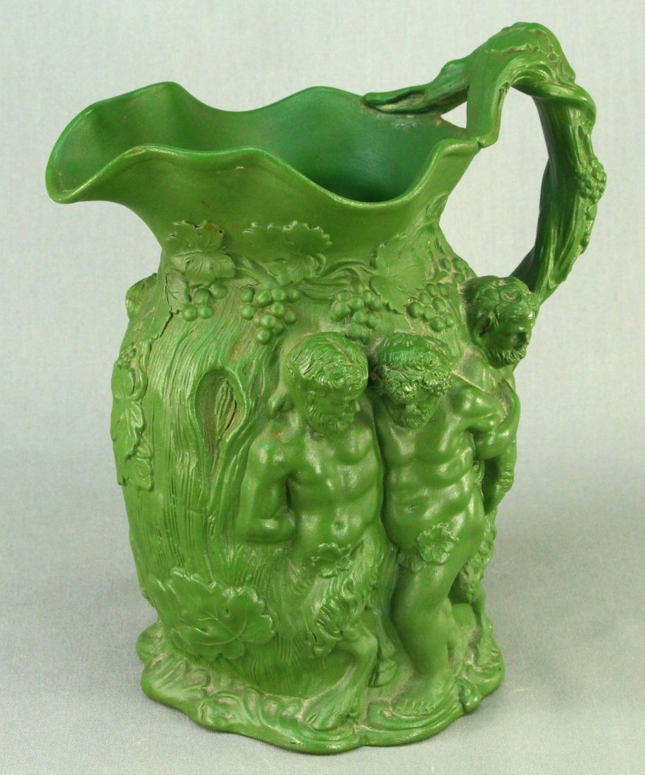 c.1817-36 MINTON Green Parian Silenuous Wine Pitcher: Antique wine pitcher, made of striking bold to matte green colored parian ware. Intricate Bacchanalia scenes all over, in a classical taste, with intense, vivacious detail. A group of older men on one