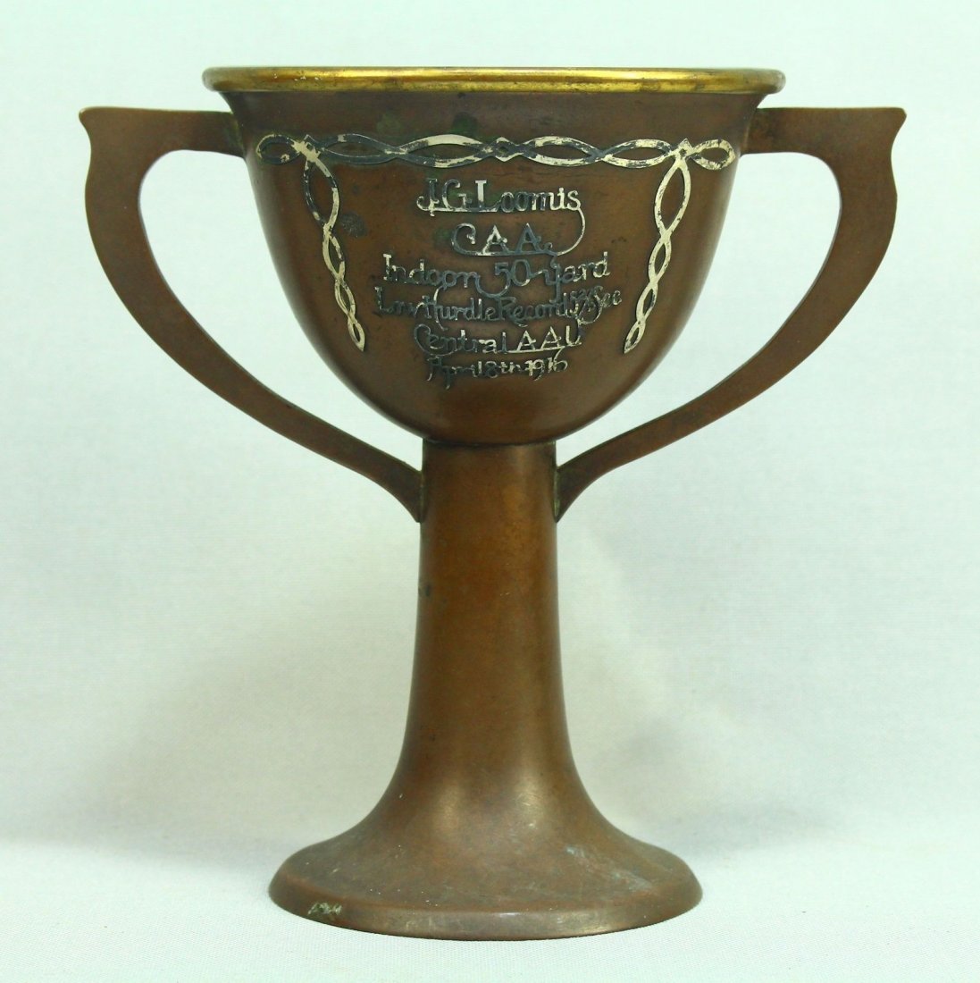 1916 HEINTZ ART METAL Copper & Sterling Athletic Trophy: Athletic Trophy Cup from the beginning of the 20th century. Awarded at the 1916 Indoor 50-Yard Low Hurdle. It is for a record set by Jo G. Loomis of the Chicago A. A. (Amateur Athletic) - 5 2/5 second