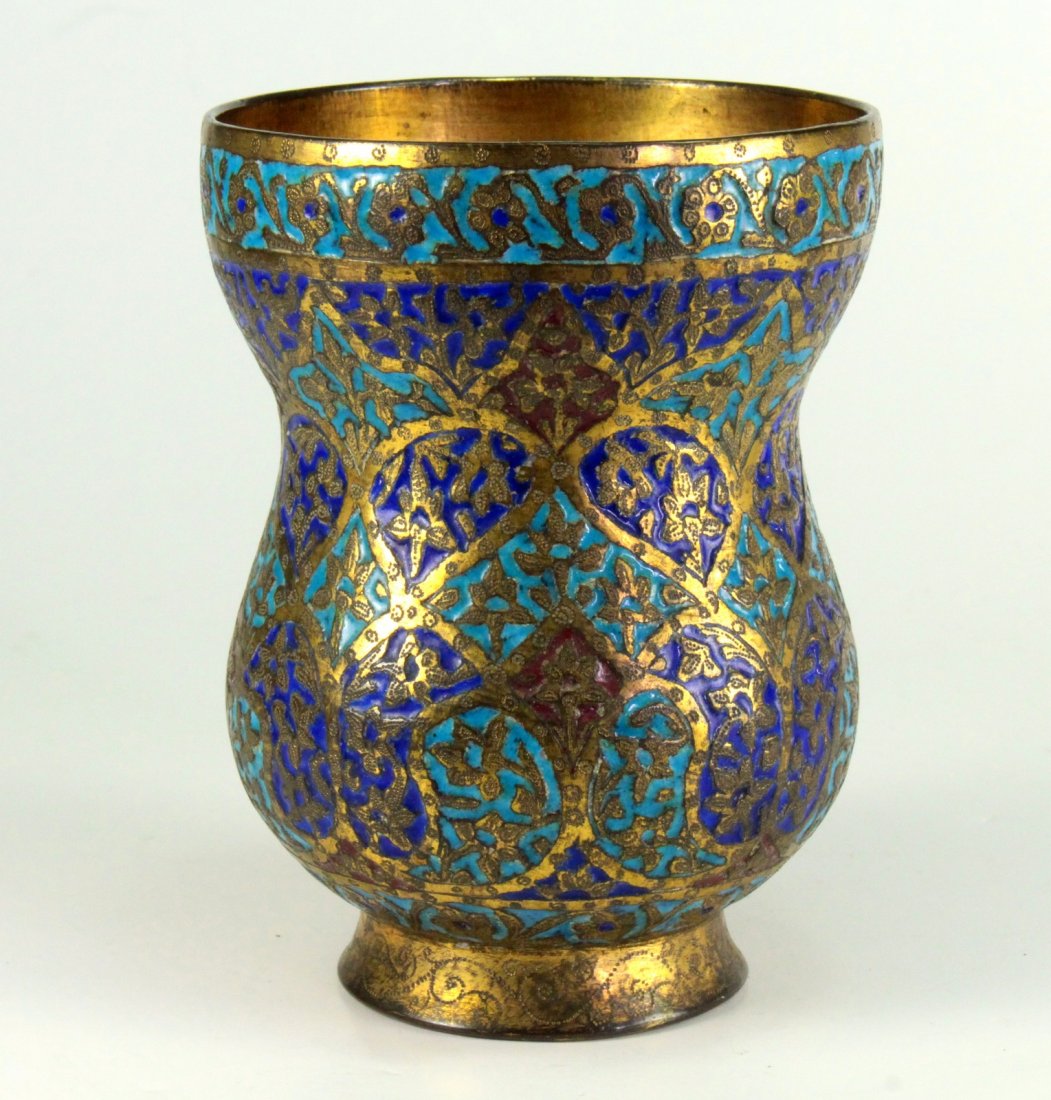 Antique Qajar Islamic Champleve Enameled Gilt Brass Cup: Аntique tumbler cup, made of thick brass with heavy gilding. Banded arabesque ornamentation and foliate patterns. Champleve celled enameled panels with Turquoise Blue, Royal Blue and Coral Red c