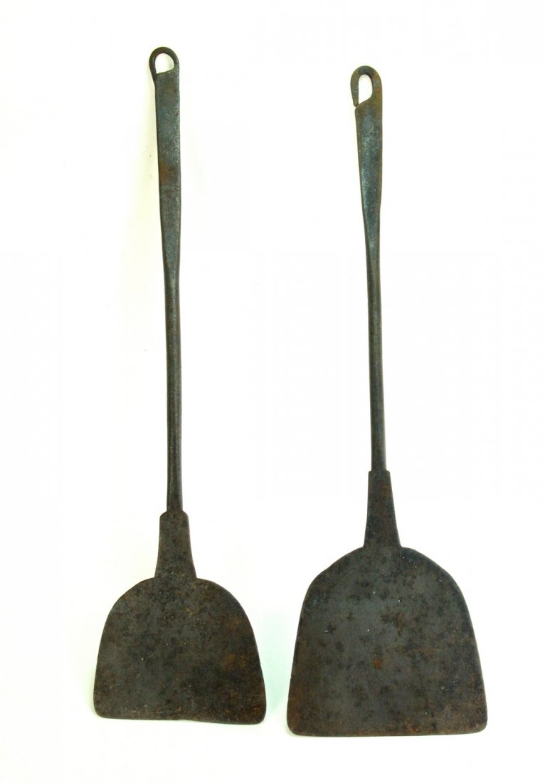 18th c. Wrought Iron Spatulas 2 pc. Open Fire Peels Lg: Early cooking utensils .A pair of hand forged iron spatulas. Nicely elaborated loops on the handle for hanging around the fire place. Circa late 1700's/early 1800's, possibly Pennsylvania. Come from a