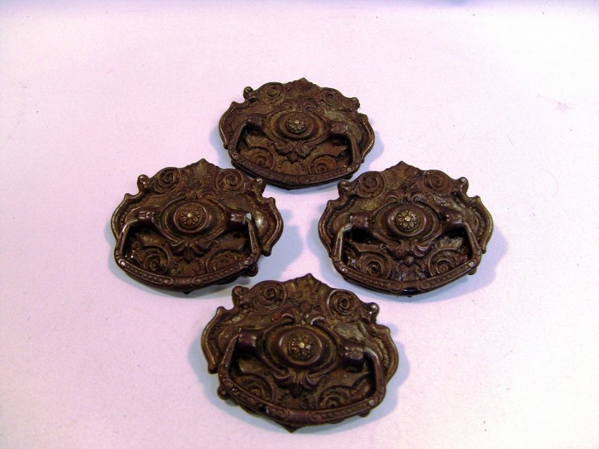 Set of 4 Victorian Ornament Drawer Pulls: Well ornamented in Victorian taste. Date back to c.mid/late 1800's. Measurements: Approx. 2.3" x 2" each