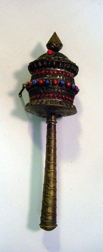 Hand Tooled Tibetan Buddhist Mani Prayer Wheel: Tibetan Mani Prayer Wheel (Khor). Hand hammered metal, possibly low grade Silver or copper alloy. Inlaid Red, Blue and Turquoise Coral beads. Mantra prayer hand written in ink on a long strip of paper