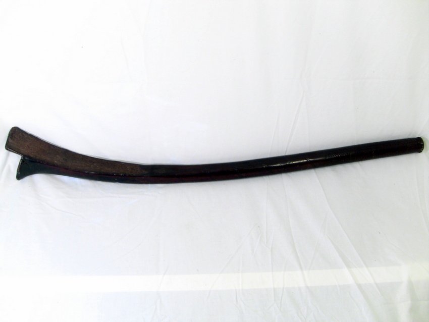 1800's Papua New Guinea Root Wood War Club: Tribal War club weapon. Papua New Guinea, South Pacific. All hand carved from one piece of root wood. Some traditional designs and ornamentation. Measurements: 40" long, 6" at widest