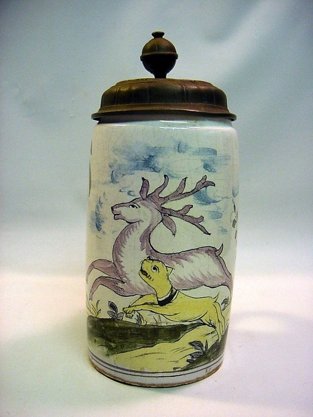 1750's N. Germany Faience, Pewter Beer Stein: Glazed and polychrome painted Faience. Cobalt Blue, Antimony Yellow, Copper Green and Manganese Violet (Mulberry) on White. Hunting dog chasing a deer. Original Pewter lid. Northern German in origin f
