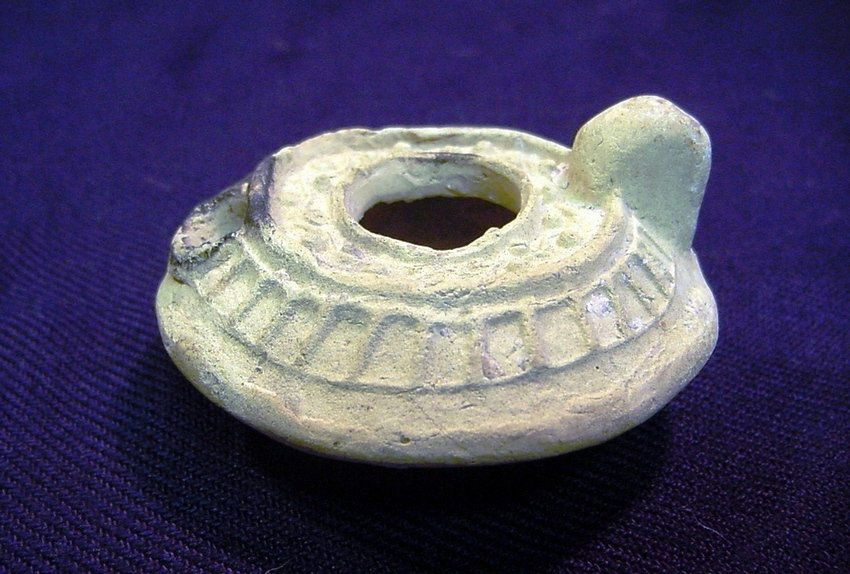 II-V A.D. Roman White Clay Ceramic Oil Lamp: White clay earthenware. Late Roman/early Byzantine artifact. Circa II-V A.D. Measurements: Approx. 2.75" diameter, 1.4" high