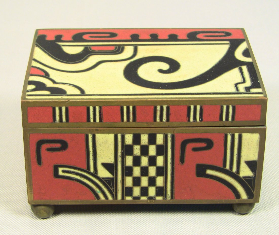 Chinese ART DECO Enamel & Brass Jewelry Box: Brass & thick Red, Black & White enamel. Art Deco design and patterns. Turquoise blue enamel on bottom. Four feet. Wood inner lining. Marked on the bottom with a paper tag, signed TAILA. Made in China