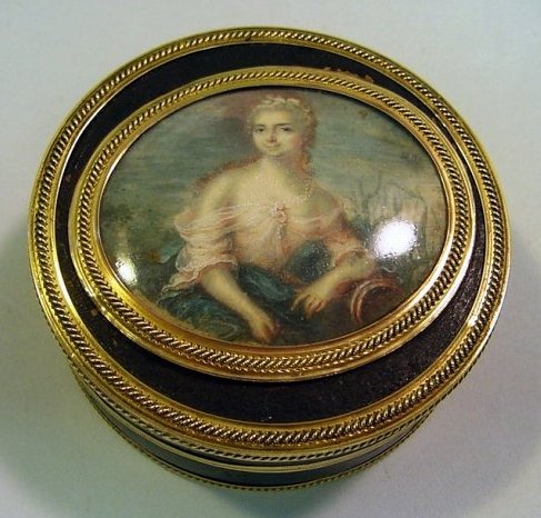 1750's Tortoise Shell, Gold Box Catherine II of Russia: Cylindrical jewelry or trinket box, made of genuine carved tortoise shell, covered with fine genuine leather. Detailed with fine 18-Karat Solid Gold bands and edging. Depicts a young Yekaterina Alexee