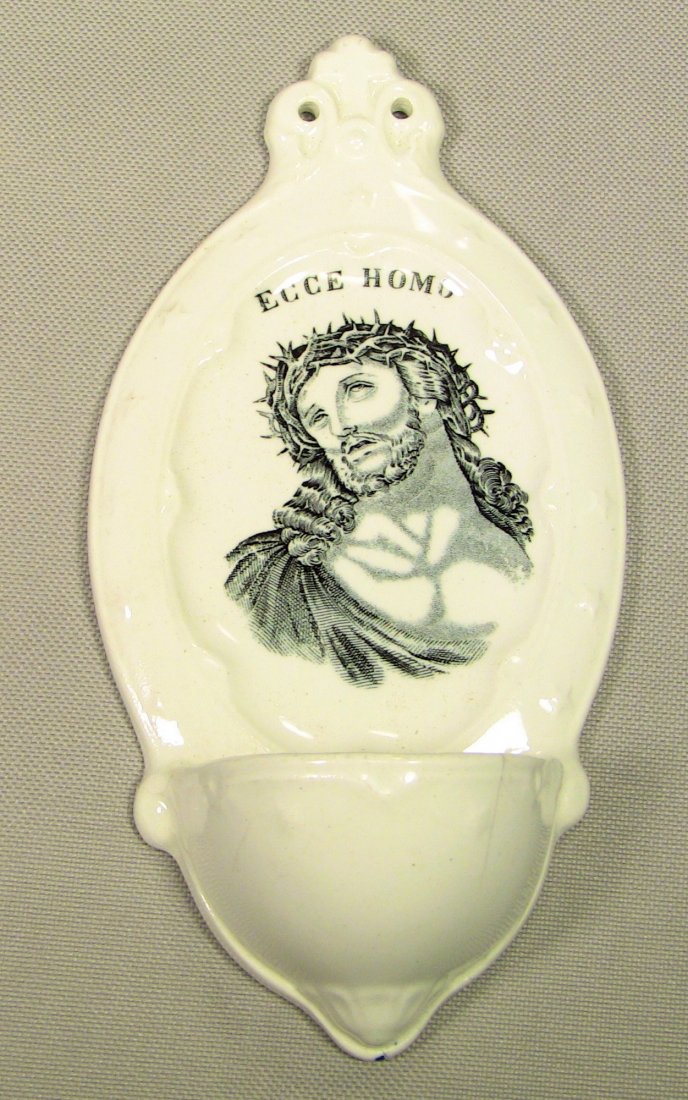 c.1884 P. REGOUT MAASTRICHT Holy Water Font Jesus: Porcelain Holy Water Font wall pocket. Rendition of Jesus Christ up front, captioned ECCE HOMO (Latin for "Behold The Man!"). Cross up top and other Religious details and ornamentation. Well marked on