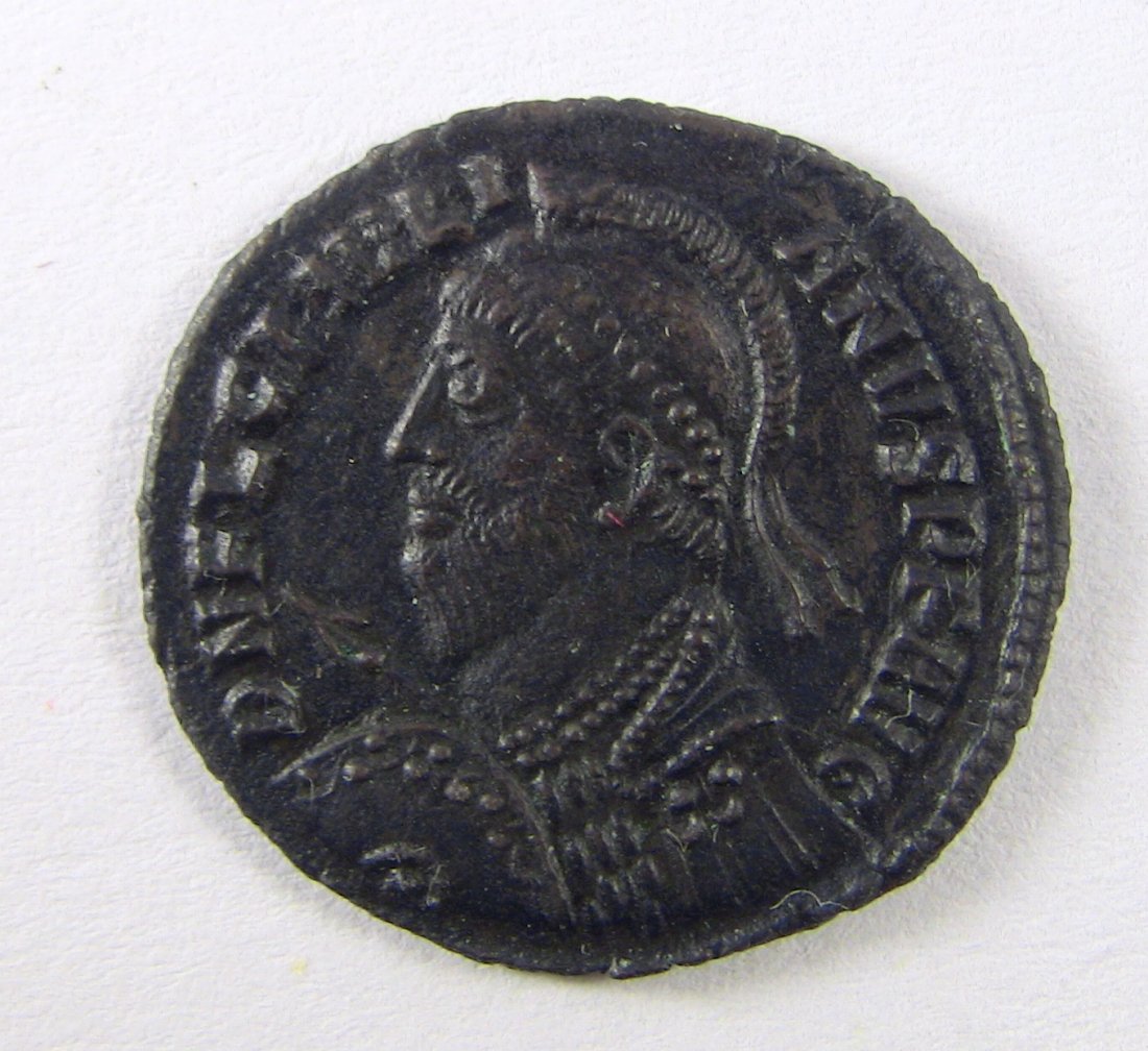 361-363 AD JULIAN II *EF* Bronze AE of Heraclea: Roman Coin, struck 361-363 AD in Heraclea. Avers: Helmeted, cuirassed bust of Julian II holding spear and shield. Reverse: VOT/X/MVLT/XX in wreath; HERACLA in ex. Reference: RIC 105. Measurements: App