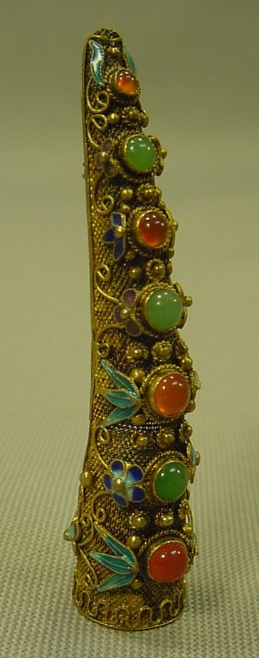 China Gilt Silver Filigree Fingernail Guard, Now Brooch: Fine high-grade silver filigree, heavily gilt with Jade and Amber tone stones. Fine enamel foliage. Finger nail protector/guard, subsequently converted to a fibula-type brooch pin, used to fasten robe
