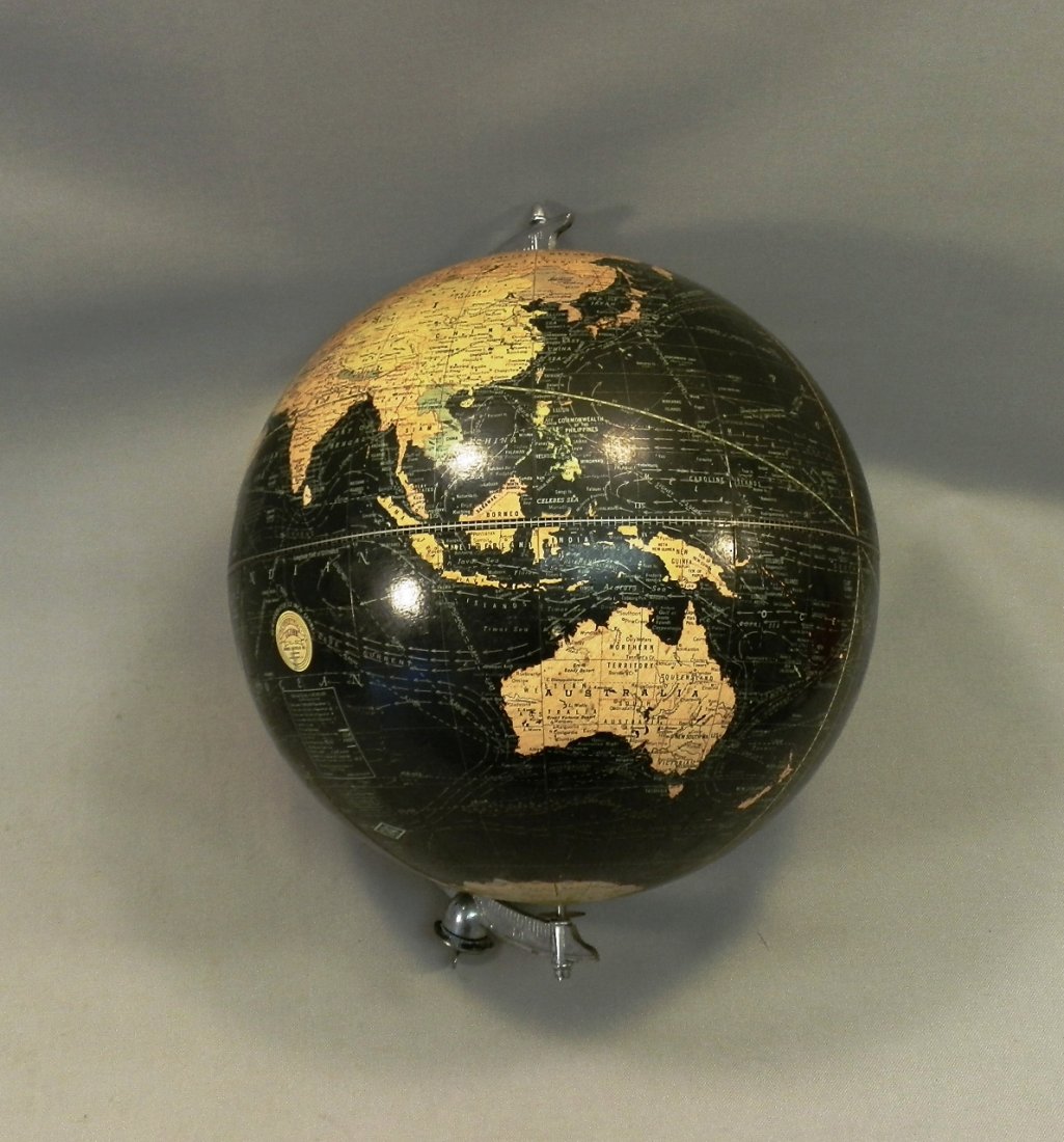 1930's Art Deco Black Terrestrial Globe Weber Costello: 12-inch peerless terrestrial globe. The oceans are black and the continents are in different colors. Chromed white metal arm. The wing nut, which connects the base with the arm, is marked "Pat. June 9