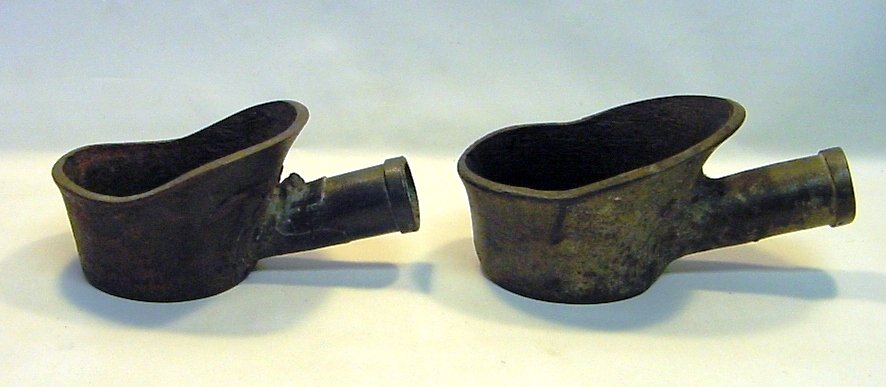 Qianlong (1736-95) Near Pair Cast Iron Charcoal Irons: A near pair of two early Chinese open coal irons. Heavy and thick cast iron. China, Qing Dynasty, Qianlong period (1736-1795). Measurements: The larger: 9" long x 4" high, 5.5" in diameter (23 cm x 10