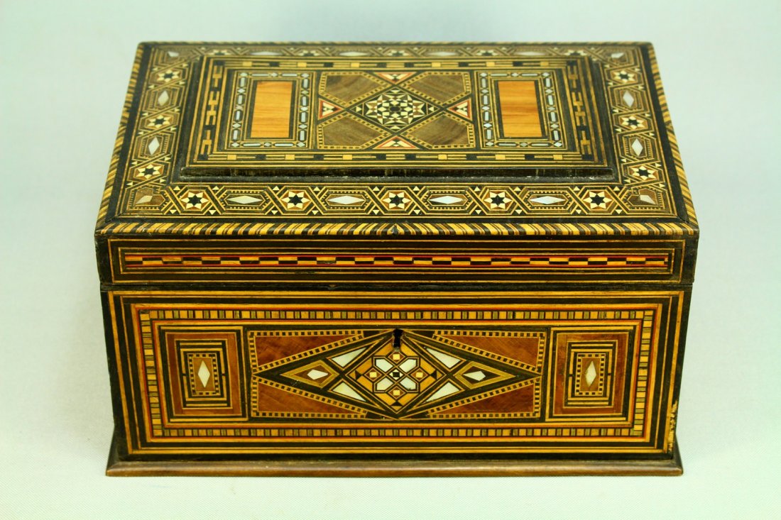 19th c. Inlaid Marquetry Tunbridge Jewelry Box, M-O-P: Antique jewelry box of very good quality. Hinged lid. Marquetry inlay of various shades of tropical wood, camel bone and Mother-of-Pearl. Intricate geometric pattern. Mirror inside. Lock up front, mec