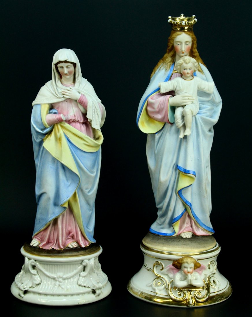 Two 19th c. Bisque Porcelain Religious Figures of Mary: Grouping of two fine bisque porcelain figures of Mary and a female Saint. Both hand painted. Standing on fancy pedestal bases. Larger statue is of Mary and Jesus (Mother & Child) adorned with a heavil