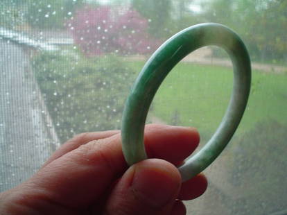 Chinese jadeite bangle: Chinese jadeite bangle. It was estimated in China for $1000 back 5 years ago. outloop 3 inches. inner loop diameter 2.25 inches.